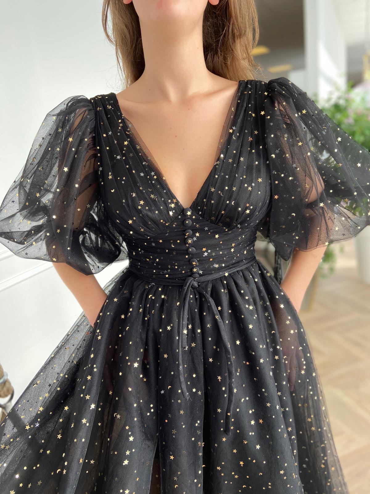 Black midi dress with v-neck, short sleeves and starry fabric