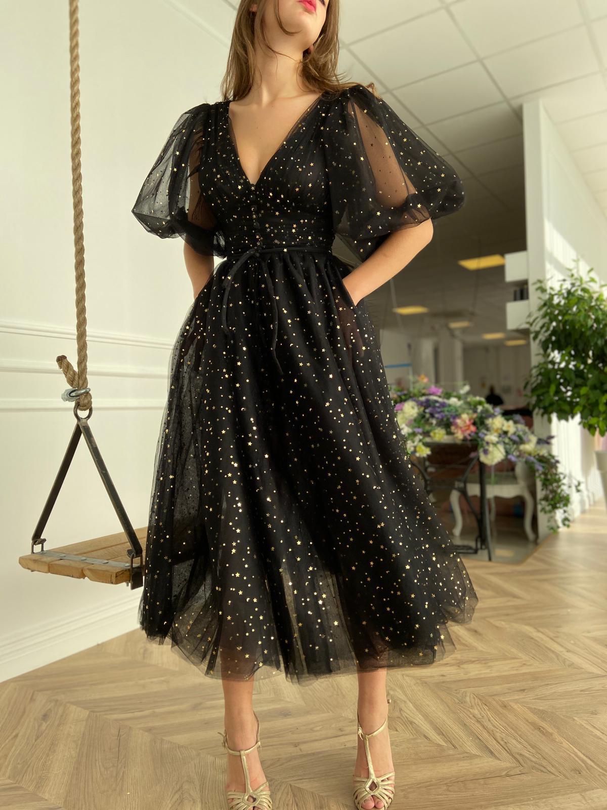 Black midi dress with v-neck, short sleeves and starry fabric