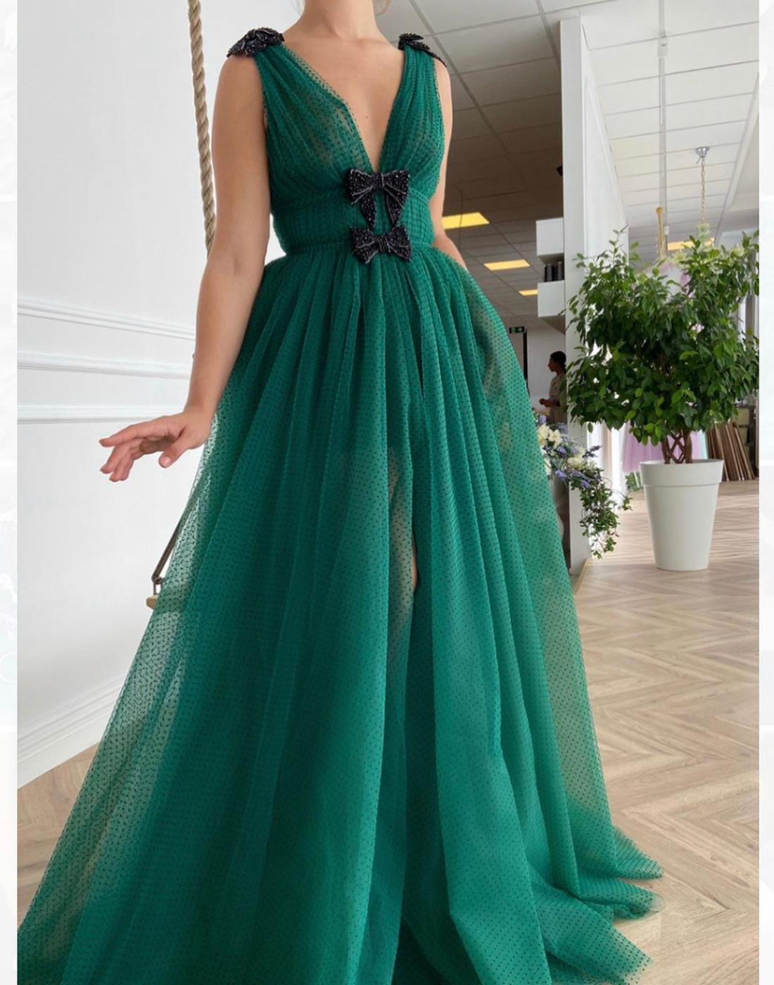 Green A-Line dress with v-neck, no sleeves and embroidery