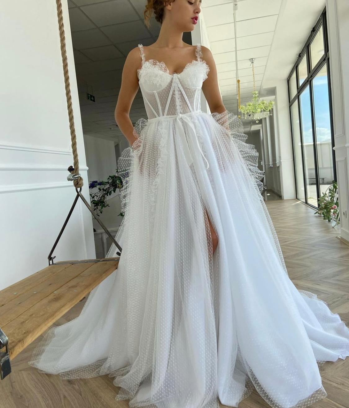 A line white bridal dress with straps