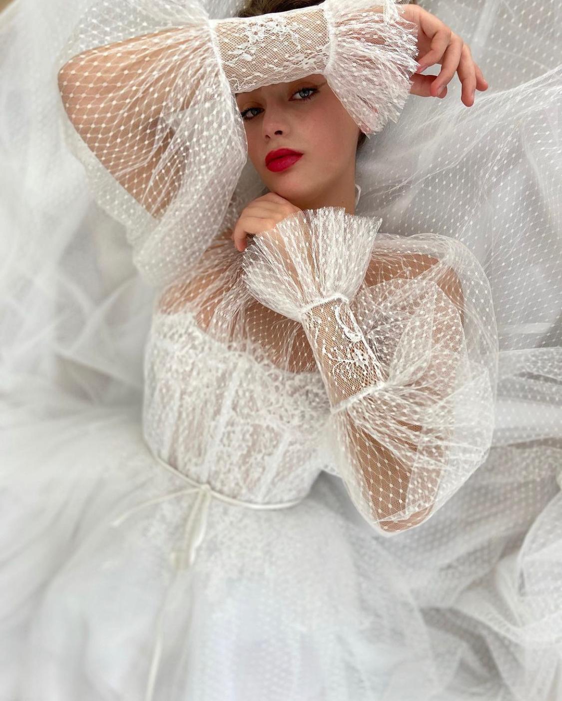 A Line white bridal dress with long sleeves and dotted