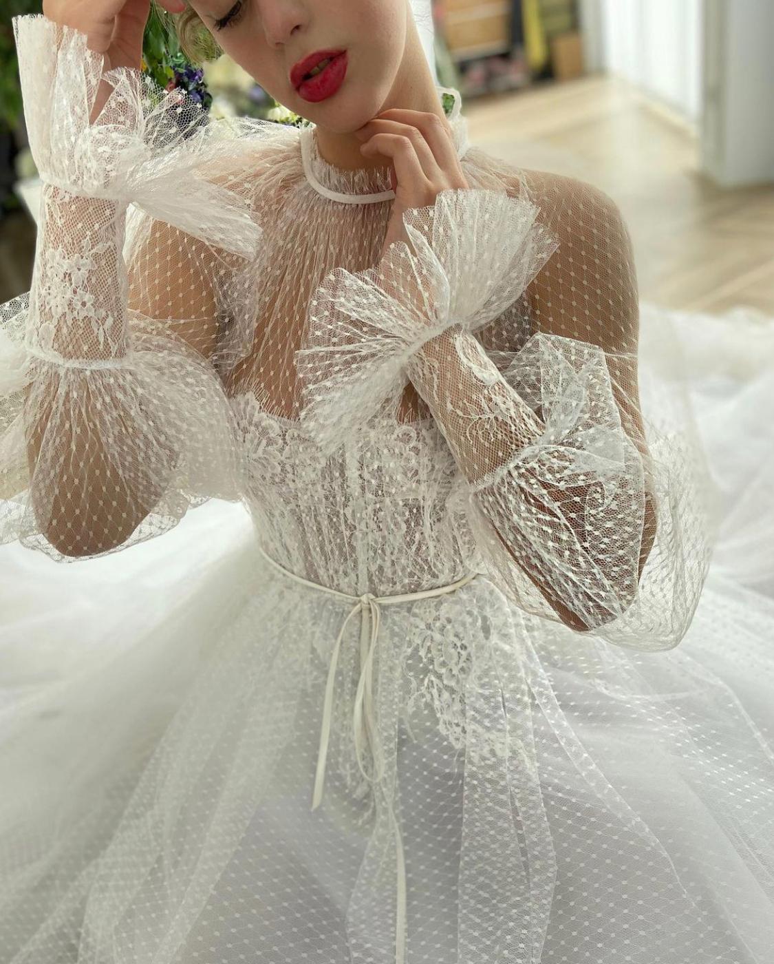 A Line white bridal dress with long sleeves and dotted