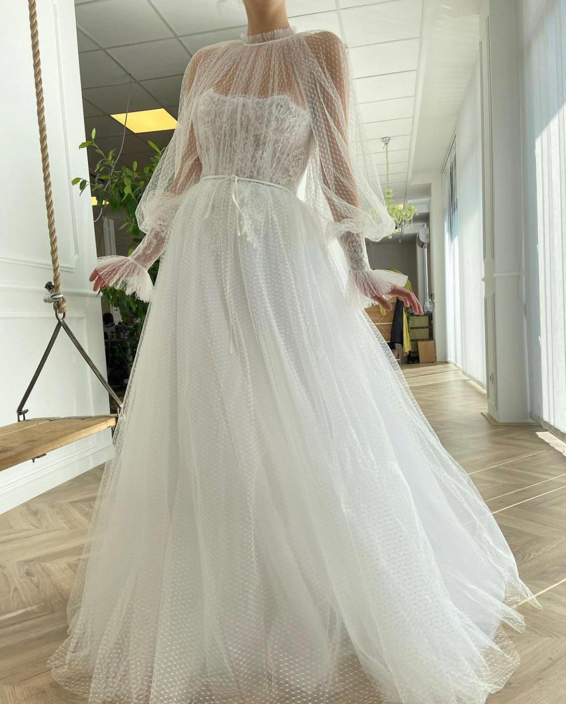 A Line white bridal dress with long sleeves and dotted