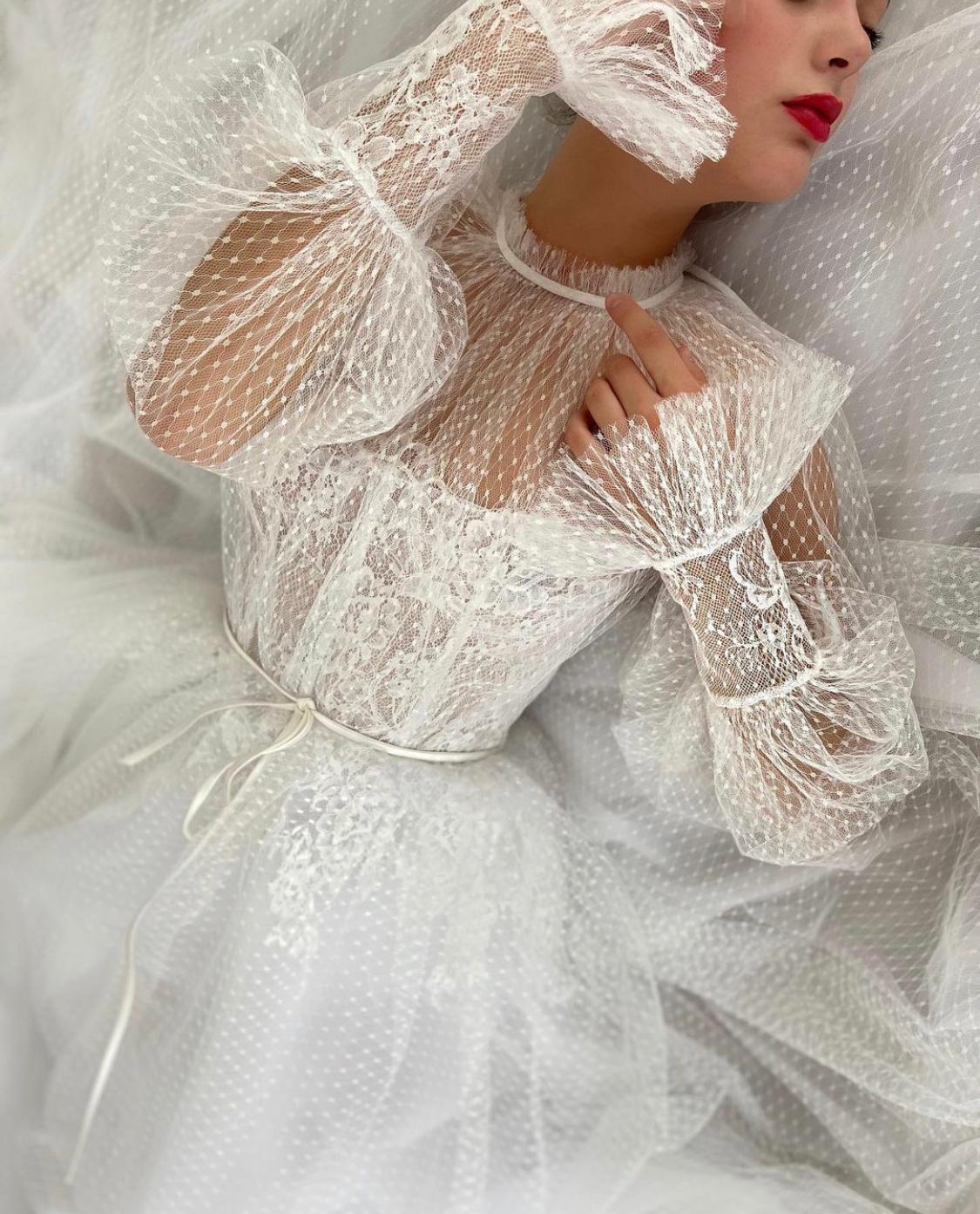 A Line white bridal dress with long sleeves and dotted
