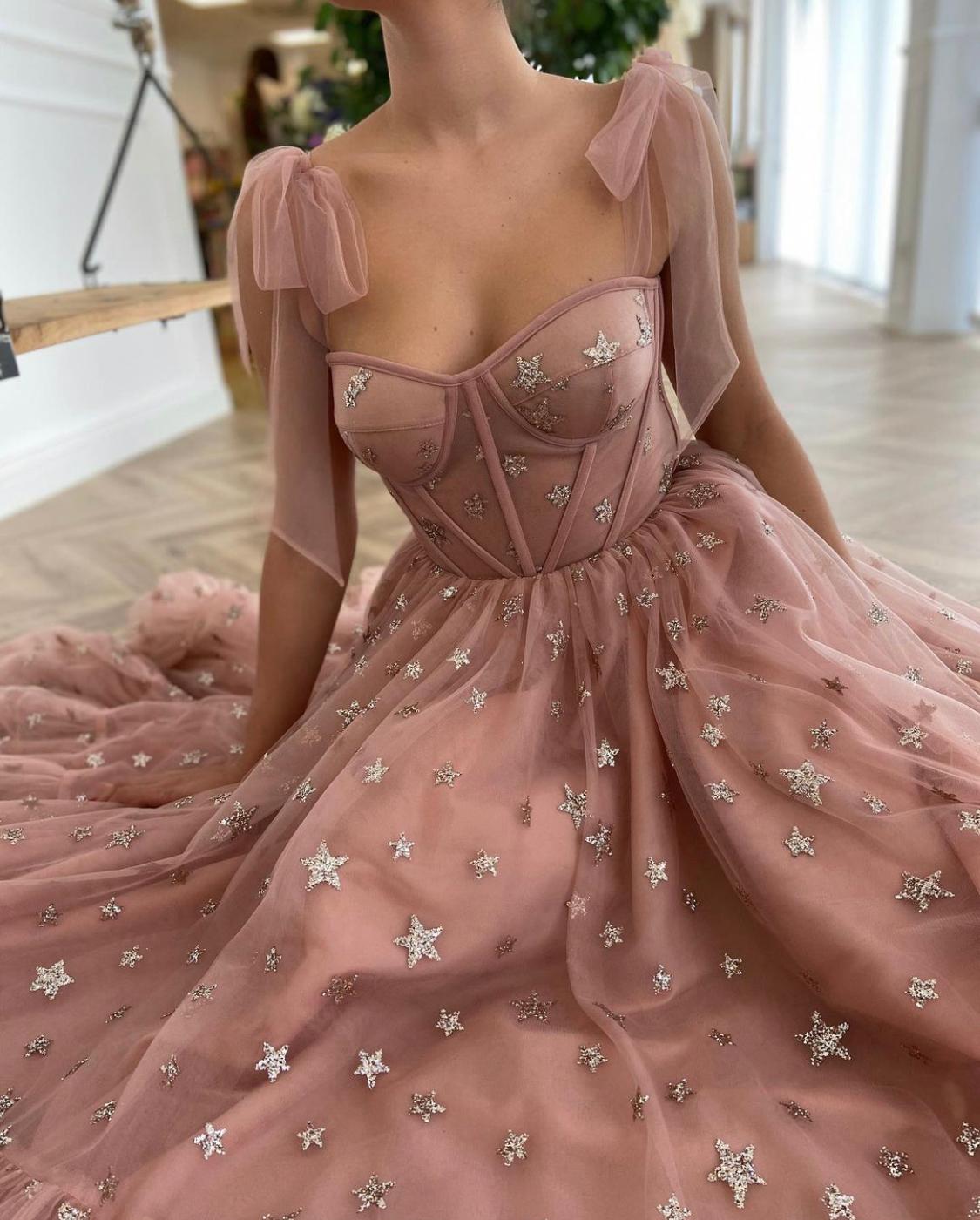 Pink midi dress with bow straps and starry fabric