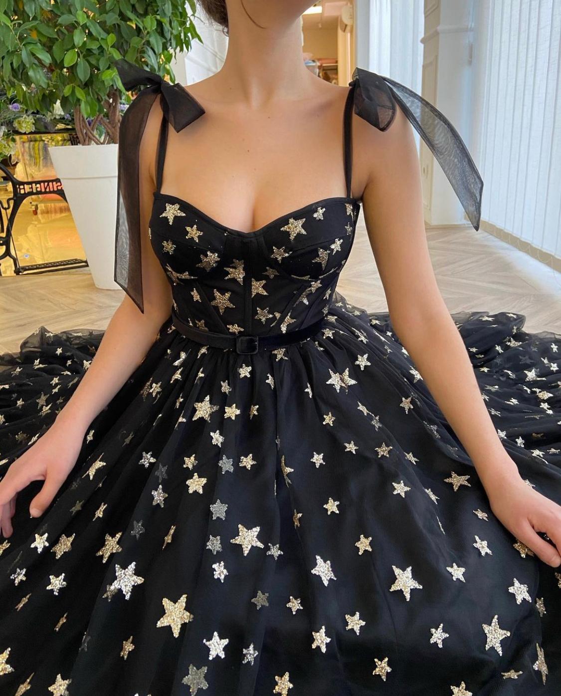 Black midi dress with bow straps and starry fabric