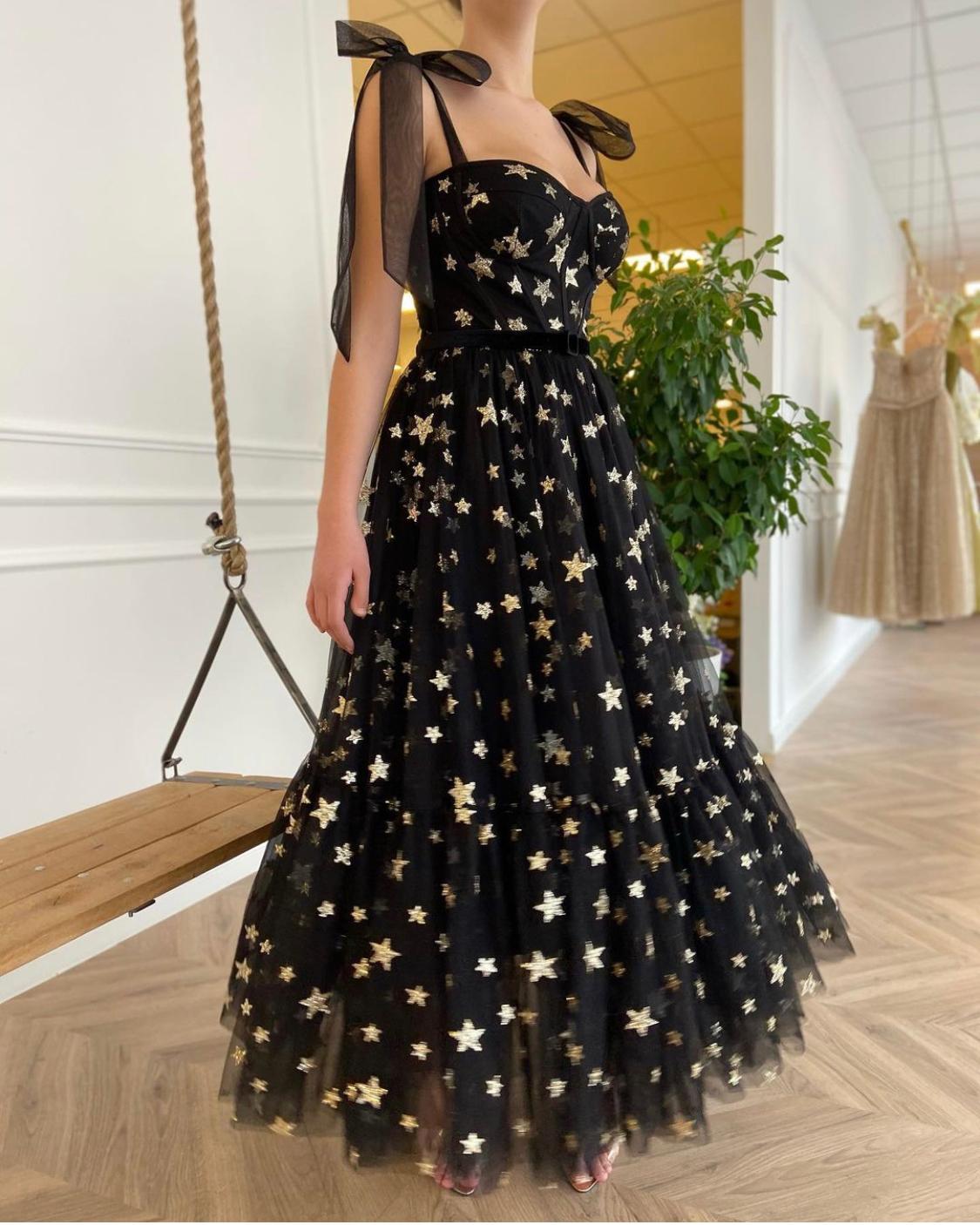 Black midi dress with bow straps and starry fabric