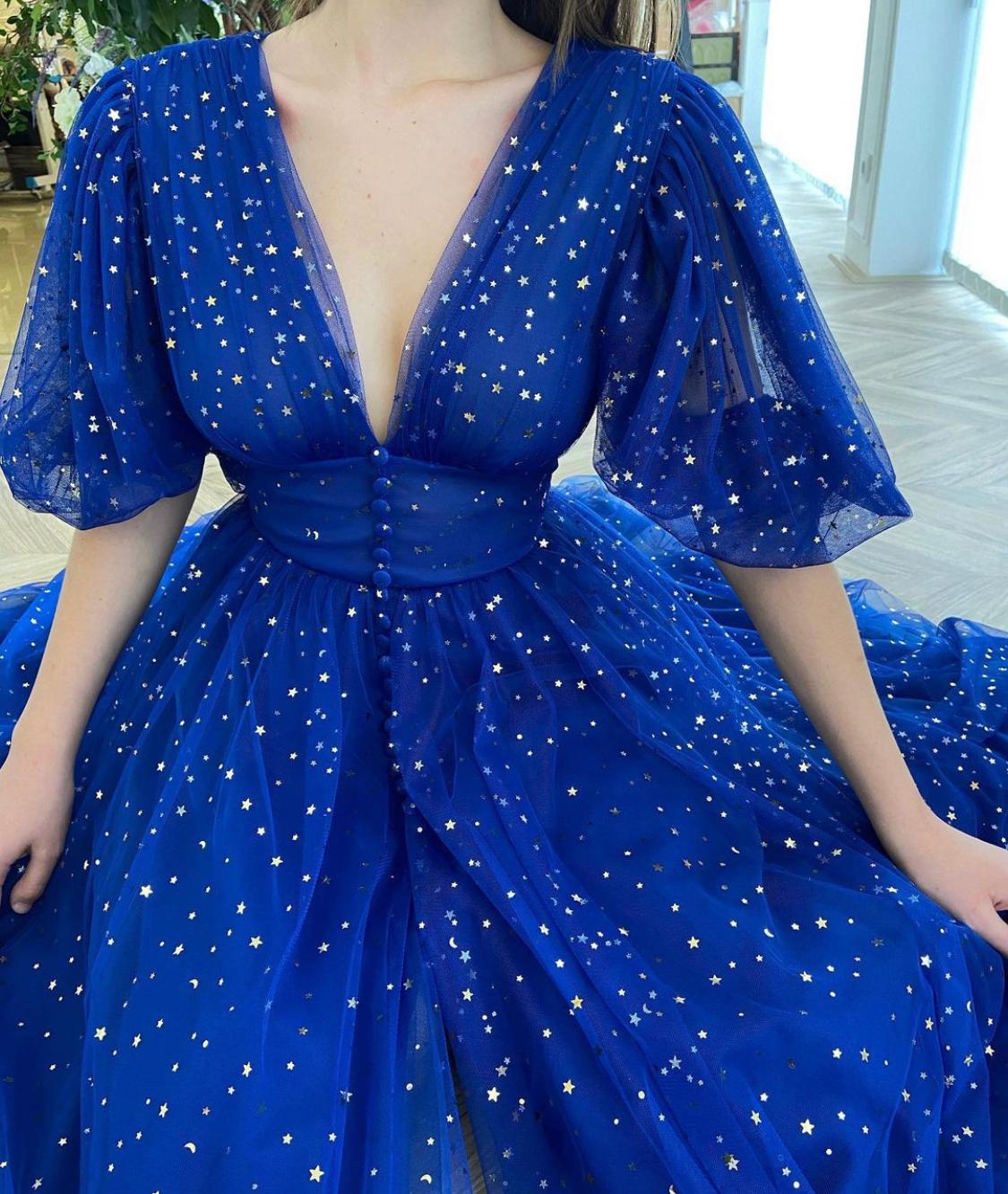 Blue midi dress with v-neck, short sleeves and starry fabric