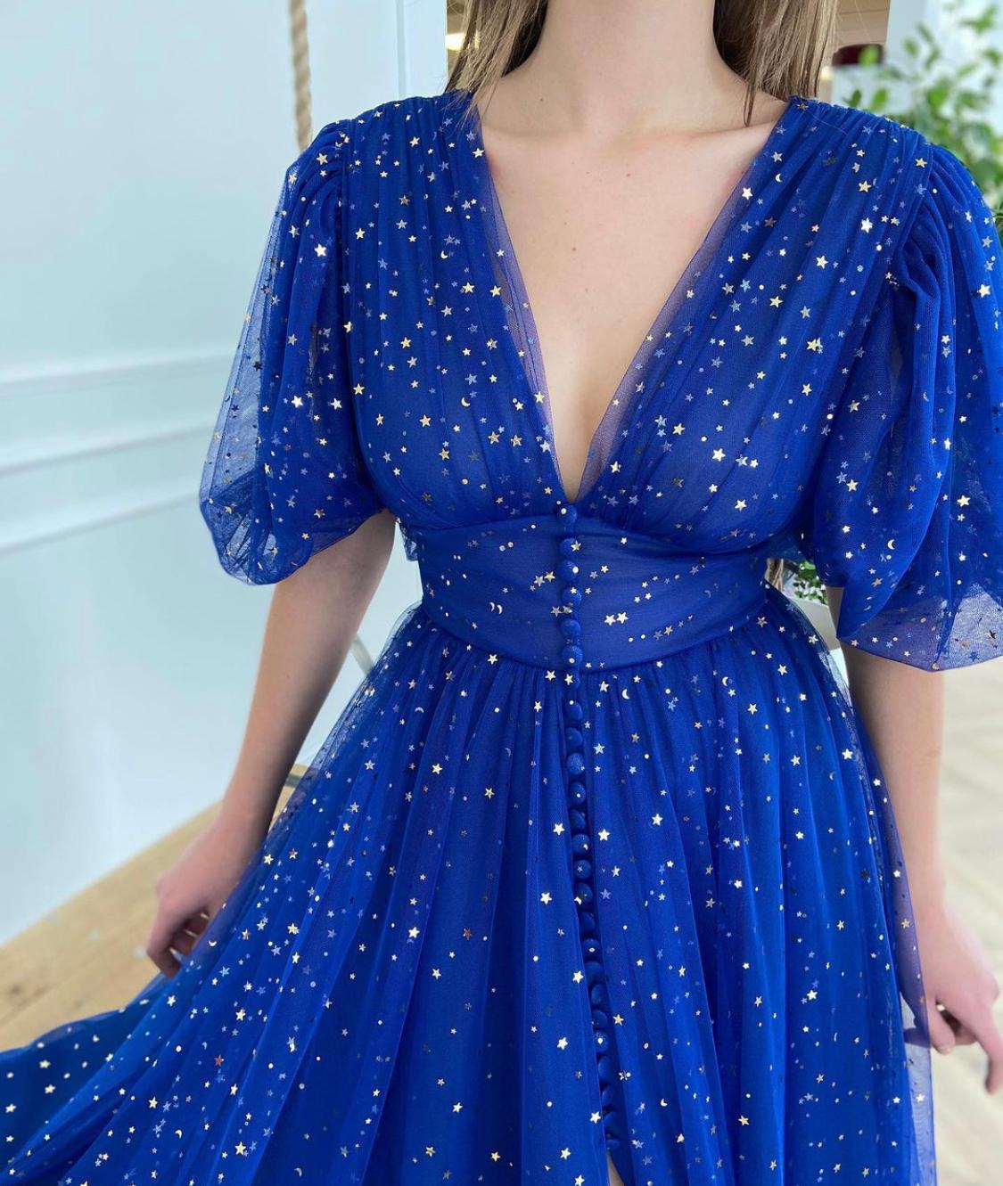 Blue midi dress with v-neck, short sleeves and starry fabric