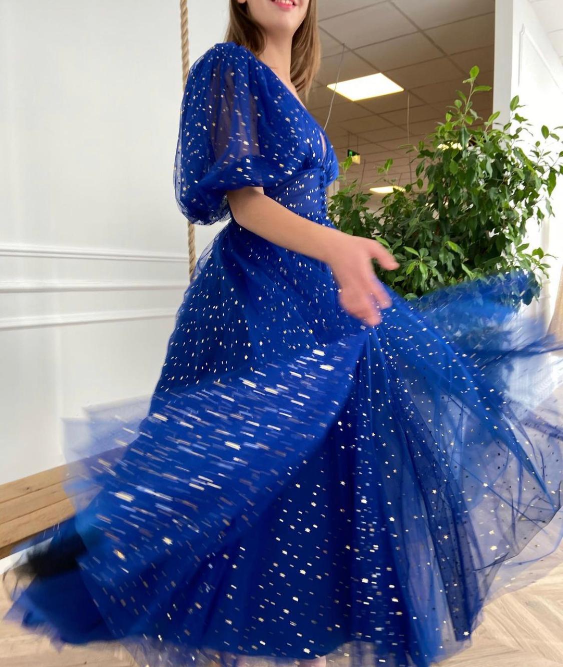 Blue midi dress with v-neck, short sleeves and starry fabric