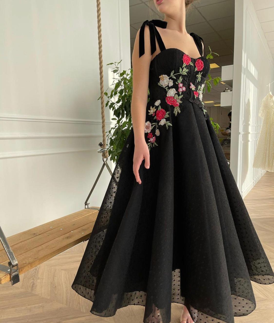 Black midi dress with bow straps and embroidery