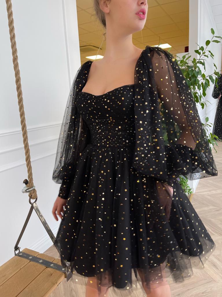 Black mini dress with long sleeves and starry fabric