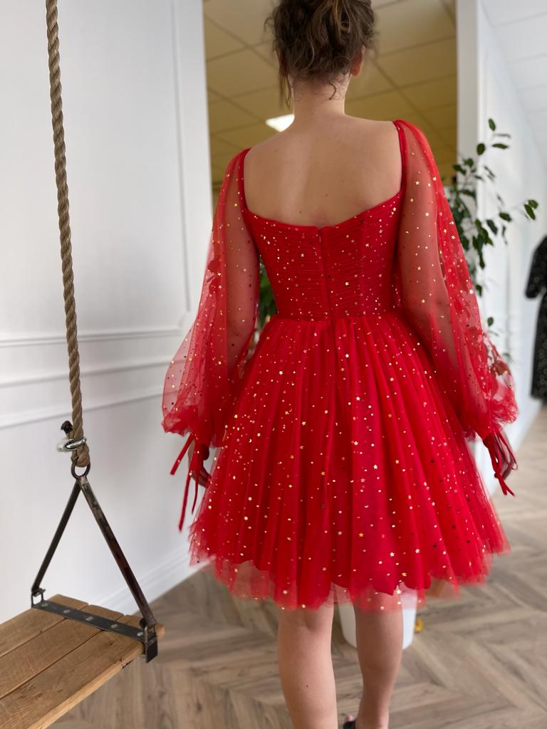 Red mini dress with long sleeves and starry fabric
