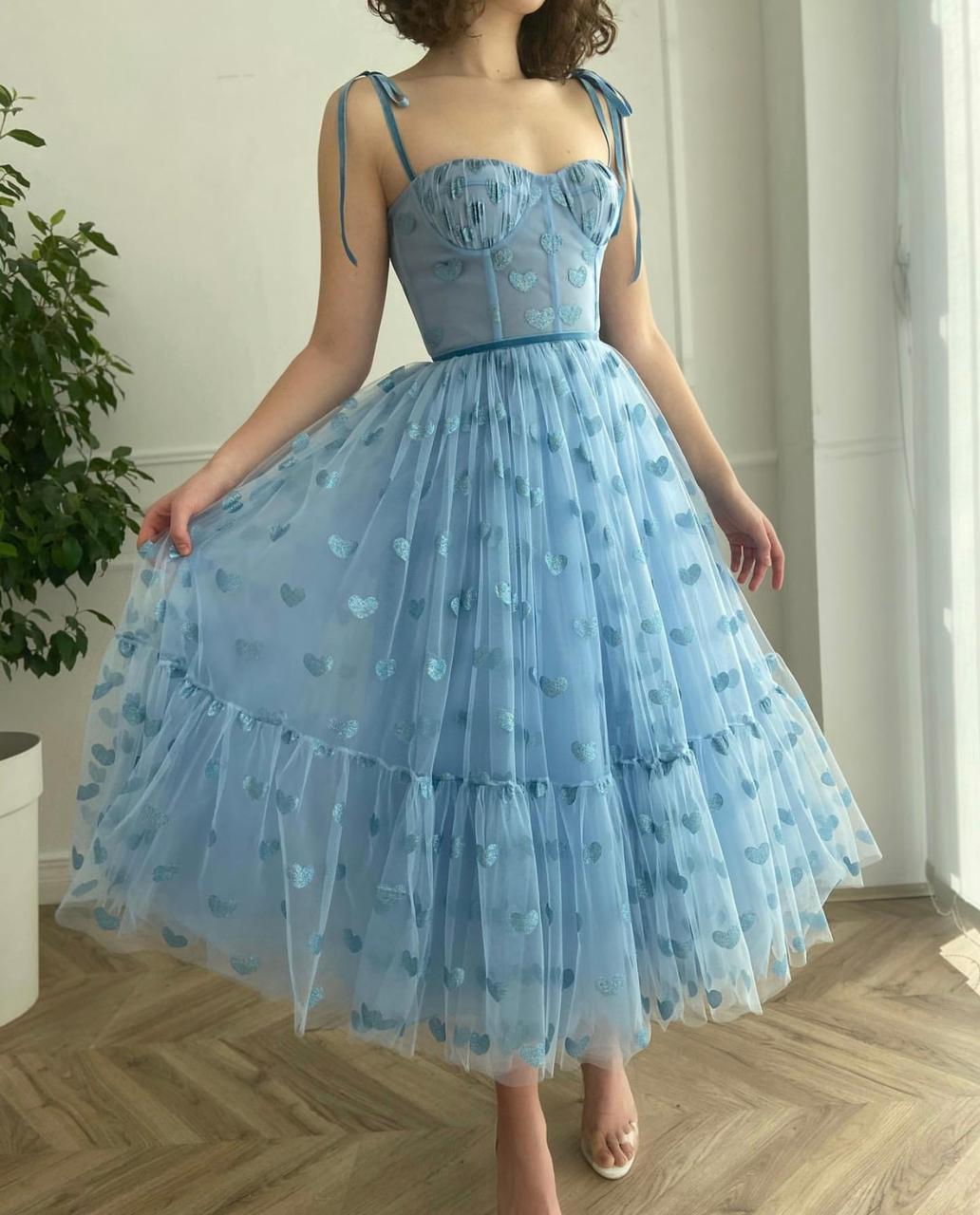 Blue midi dress with spaghetti straps and hearty fabric