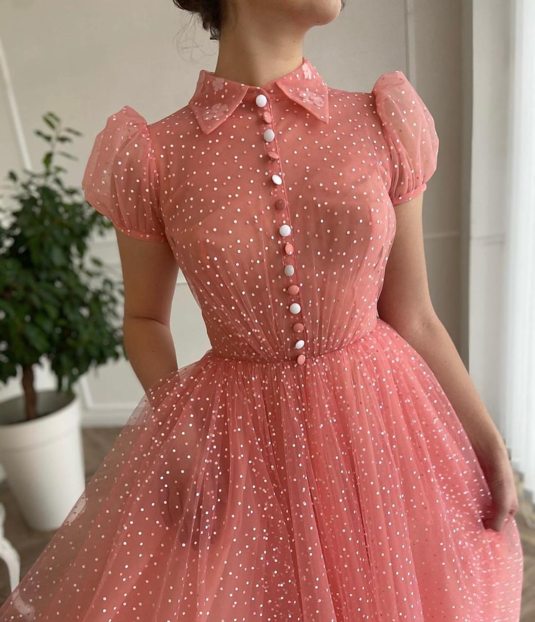 Pink midi dress with short cap sleeves and dotted fabric