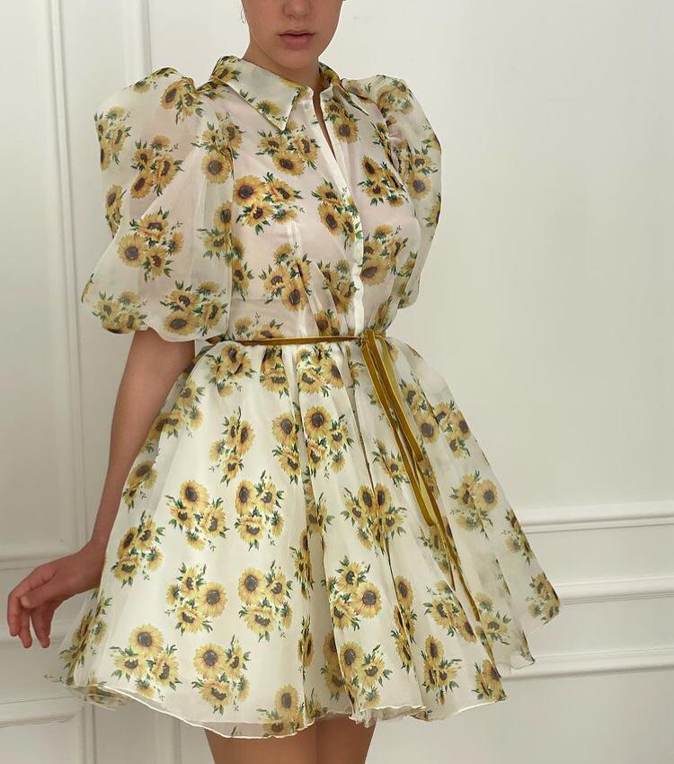 White mini dress with short sleeves and printed flowers