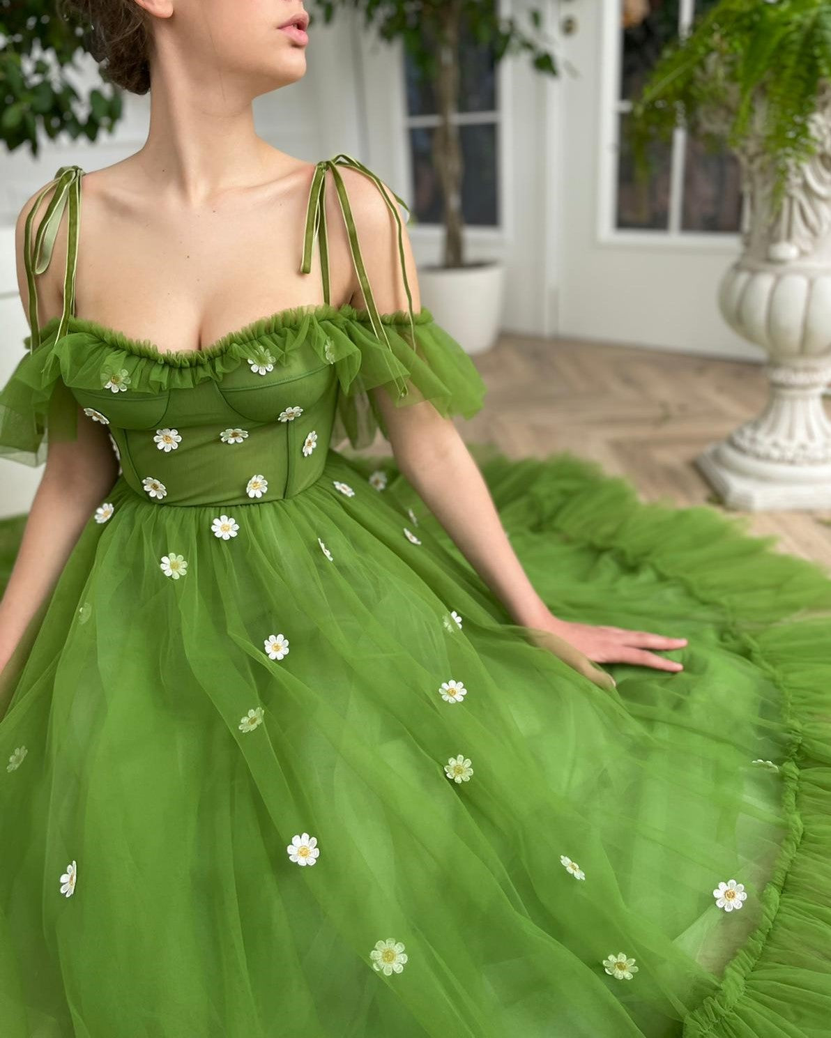 Green midi dress with spaghetti straps, off the shoulder sleeves and embroidered daisies