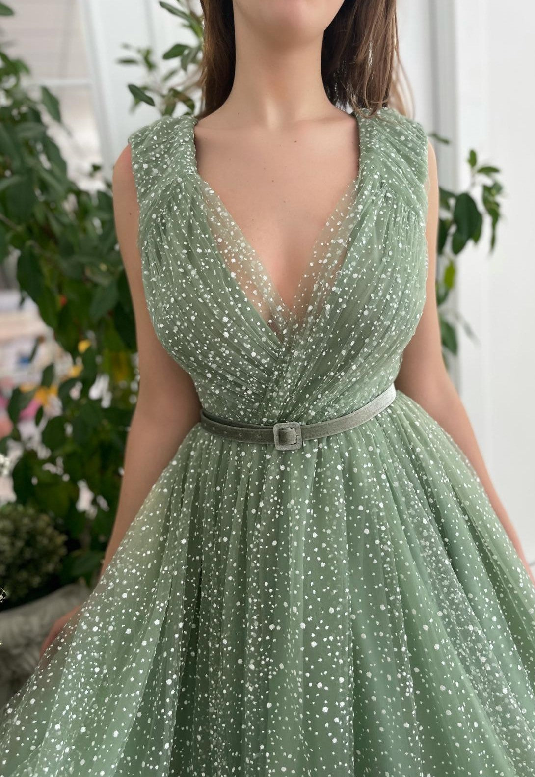 Green A-Line dress with belt, v-neck and no sleeves