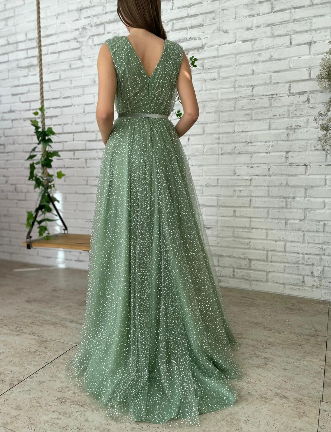 Green A-Line dress with belt, v-neck and no sleeves