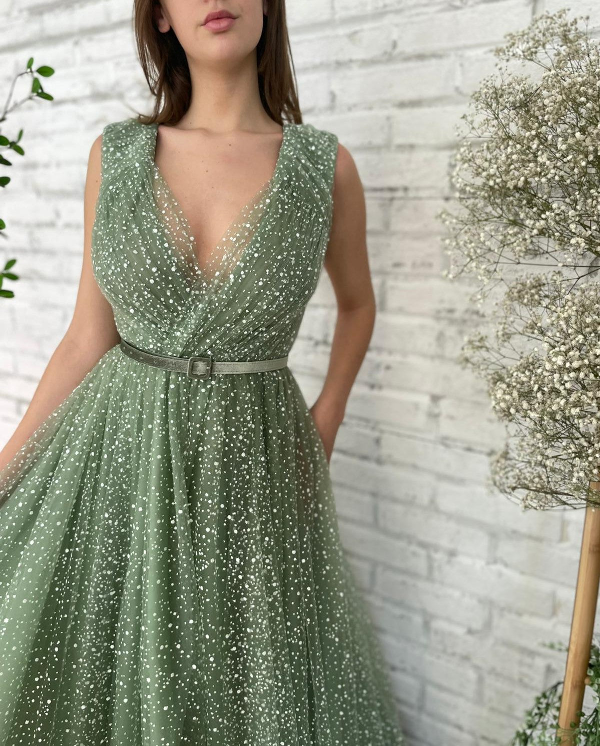 Green A-Line dress with belt, v-neck and no sleeves