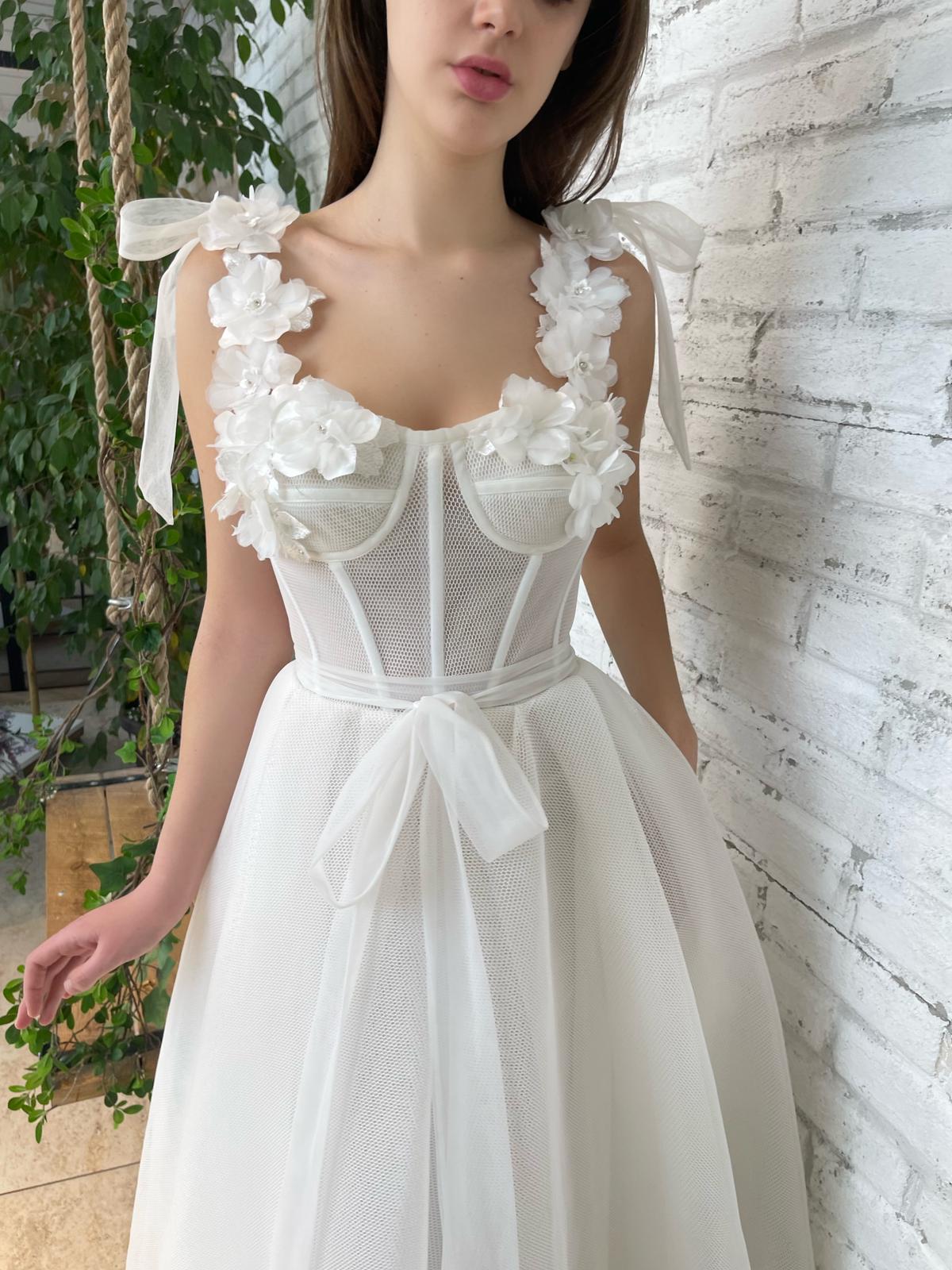 White bridal midi dress with straps, flowers and embroidery