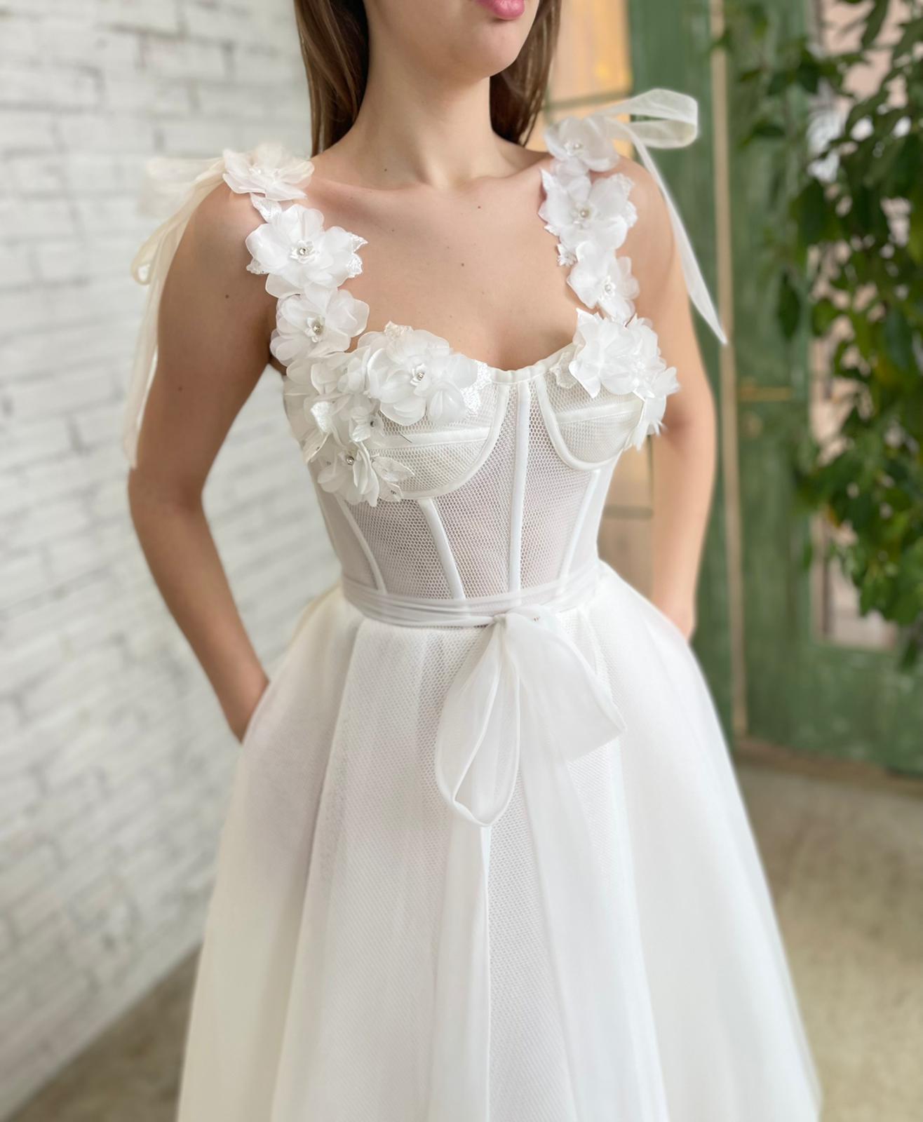 White bridal midi dress with straps, flowers and embroidery