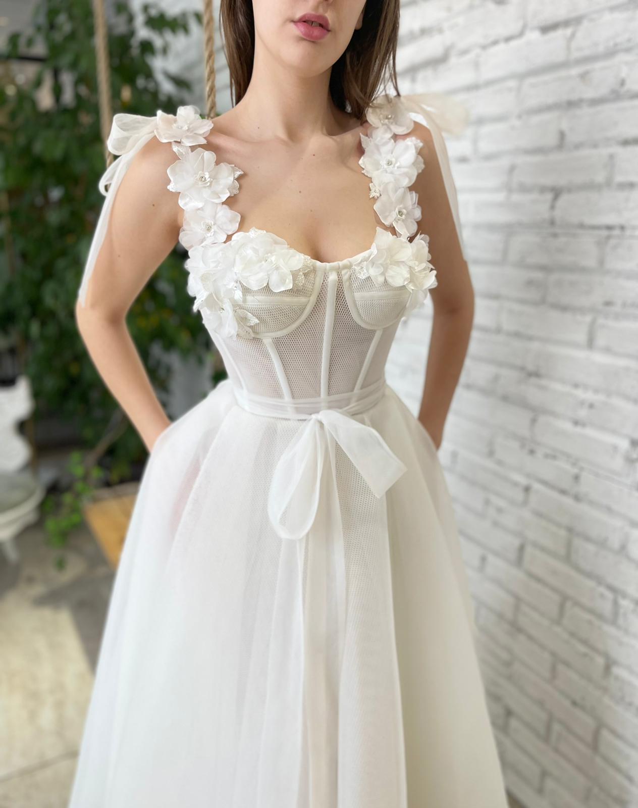 White bridal midi dress with straps, flowers and embroidery