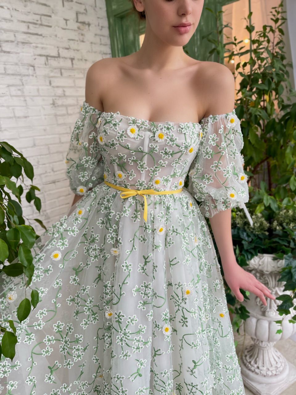 White and green midi dress with off the shoulder sleeves and daisies