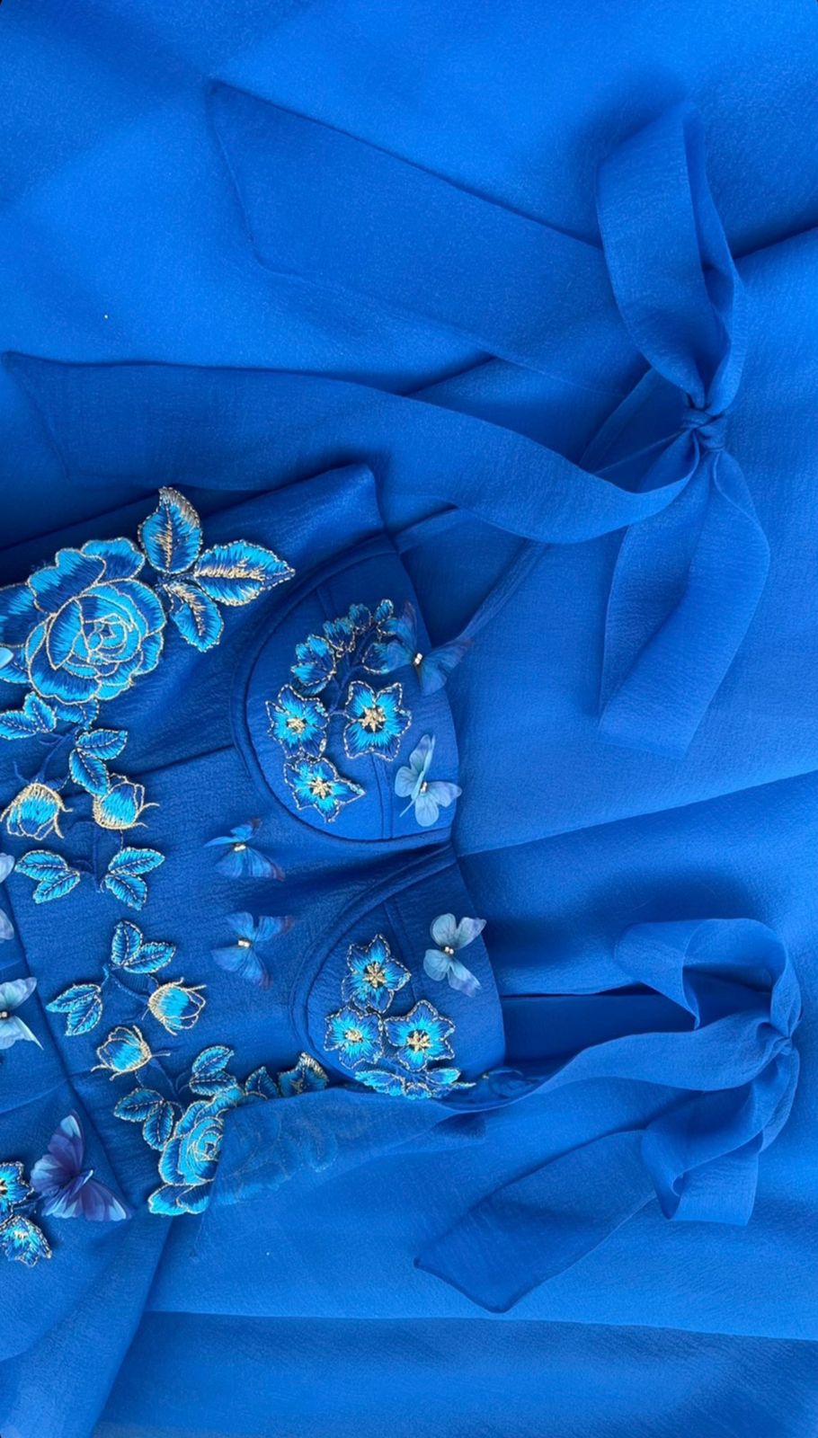 Blue midi dress with spaghetti straps, embroidery and butterflies