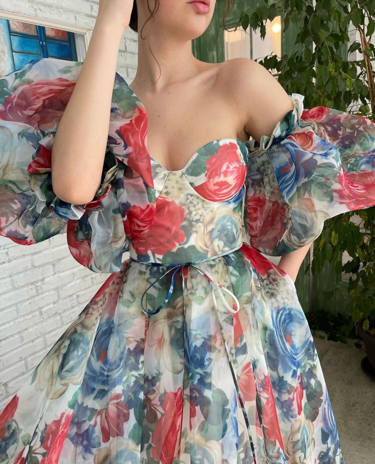 Blue and red mini dress with off the shoulder sleeves and printed flowers