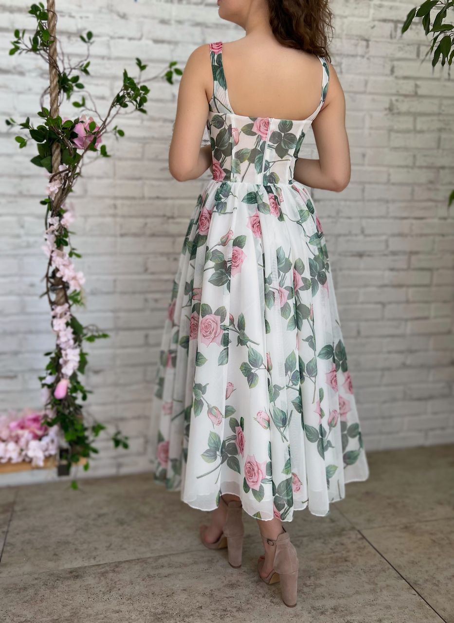 White midi dress with spaghetti straps and printed flowers