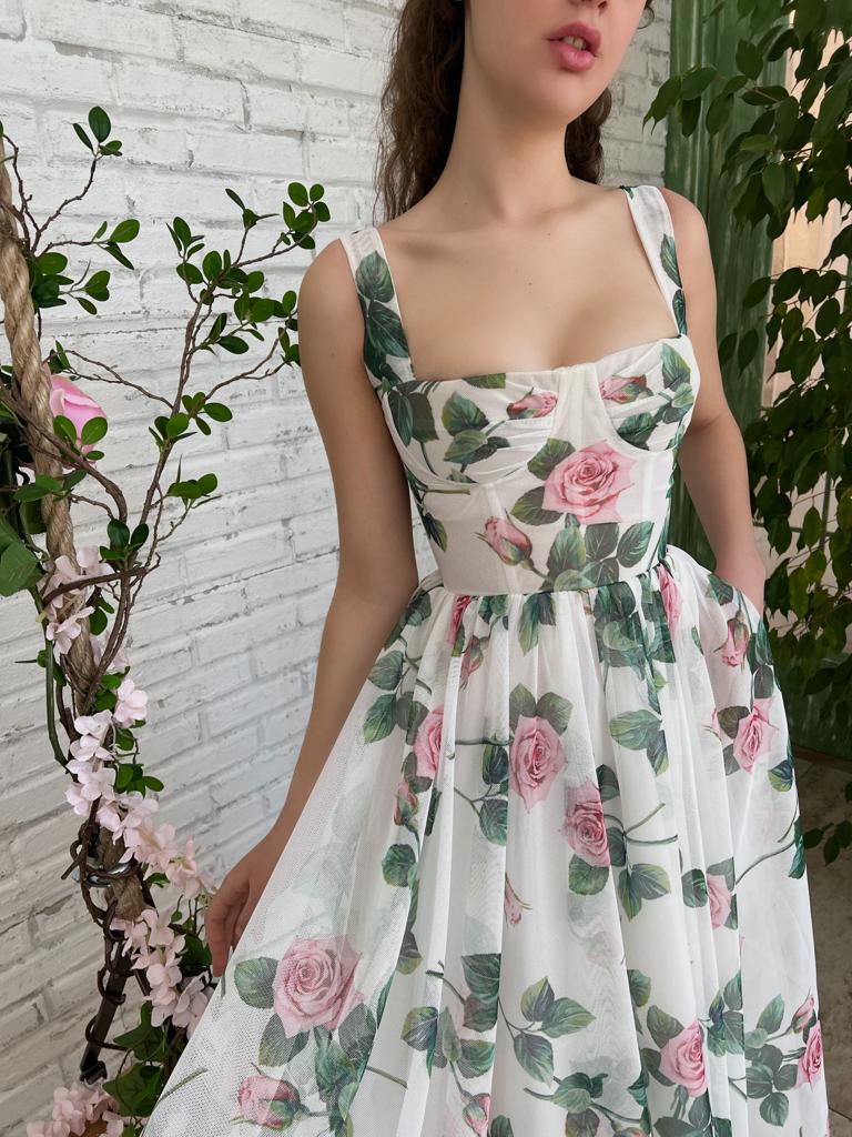 White midi dress with spaghetti straps and printed flowers