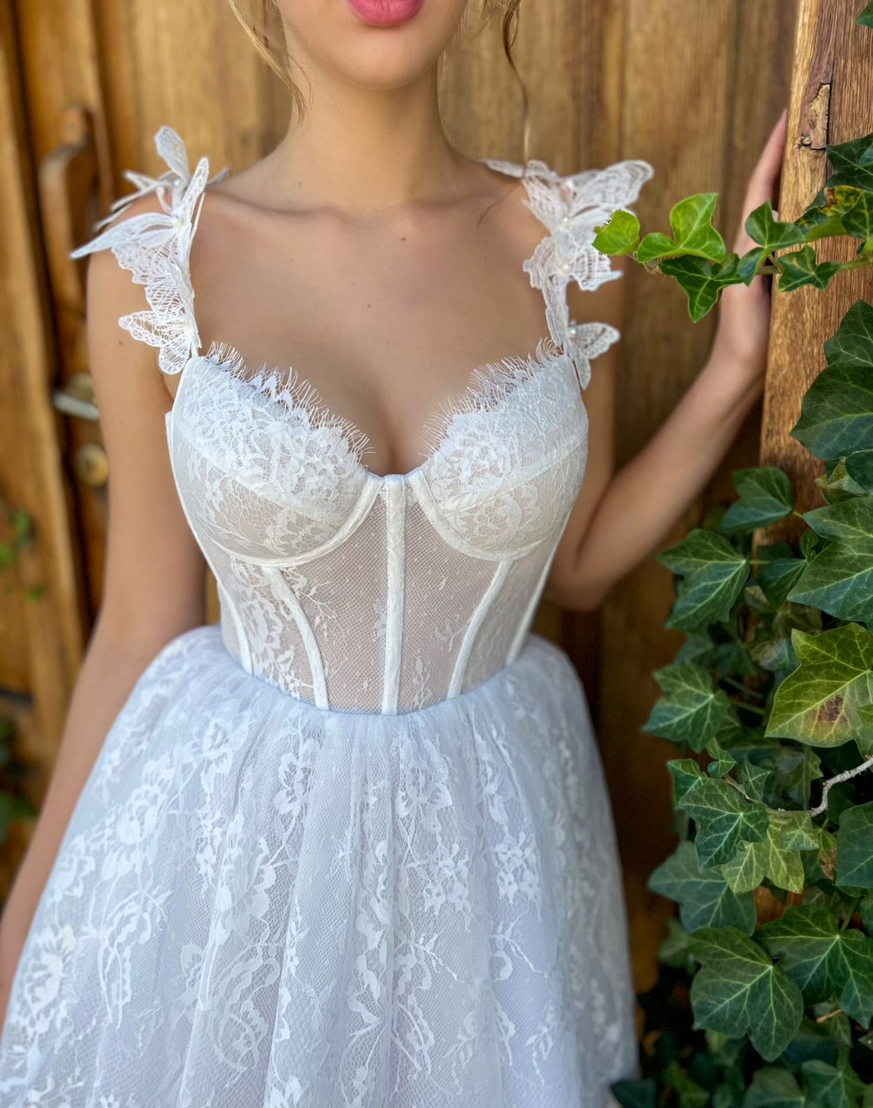 White mini dress with spaghetti straps, embroidery and butterflies