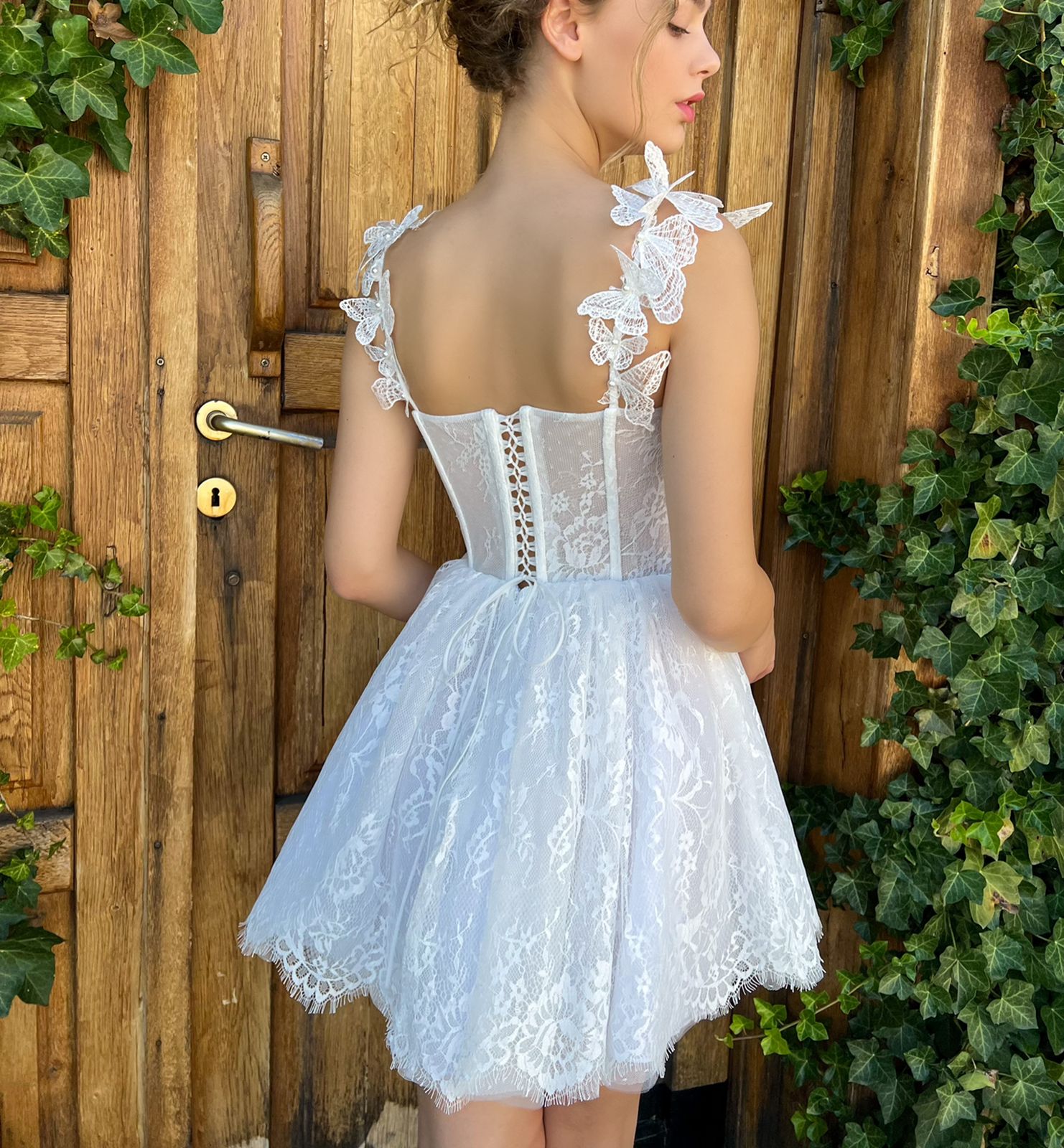 White mini dress with spaghetti straps, embroidery and butterflies