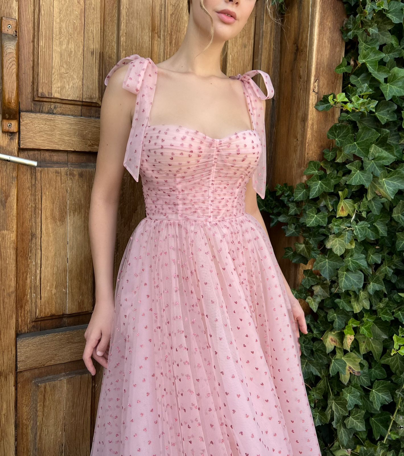 Pink midi dress with spaghetti straps and hearty fabric
