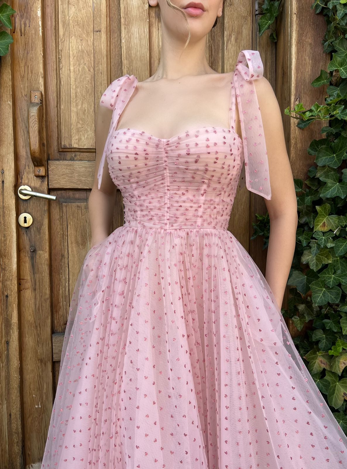 Pink midi dress with spaghetti straps and hearty fabric