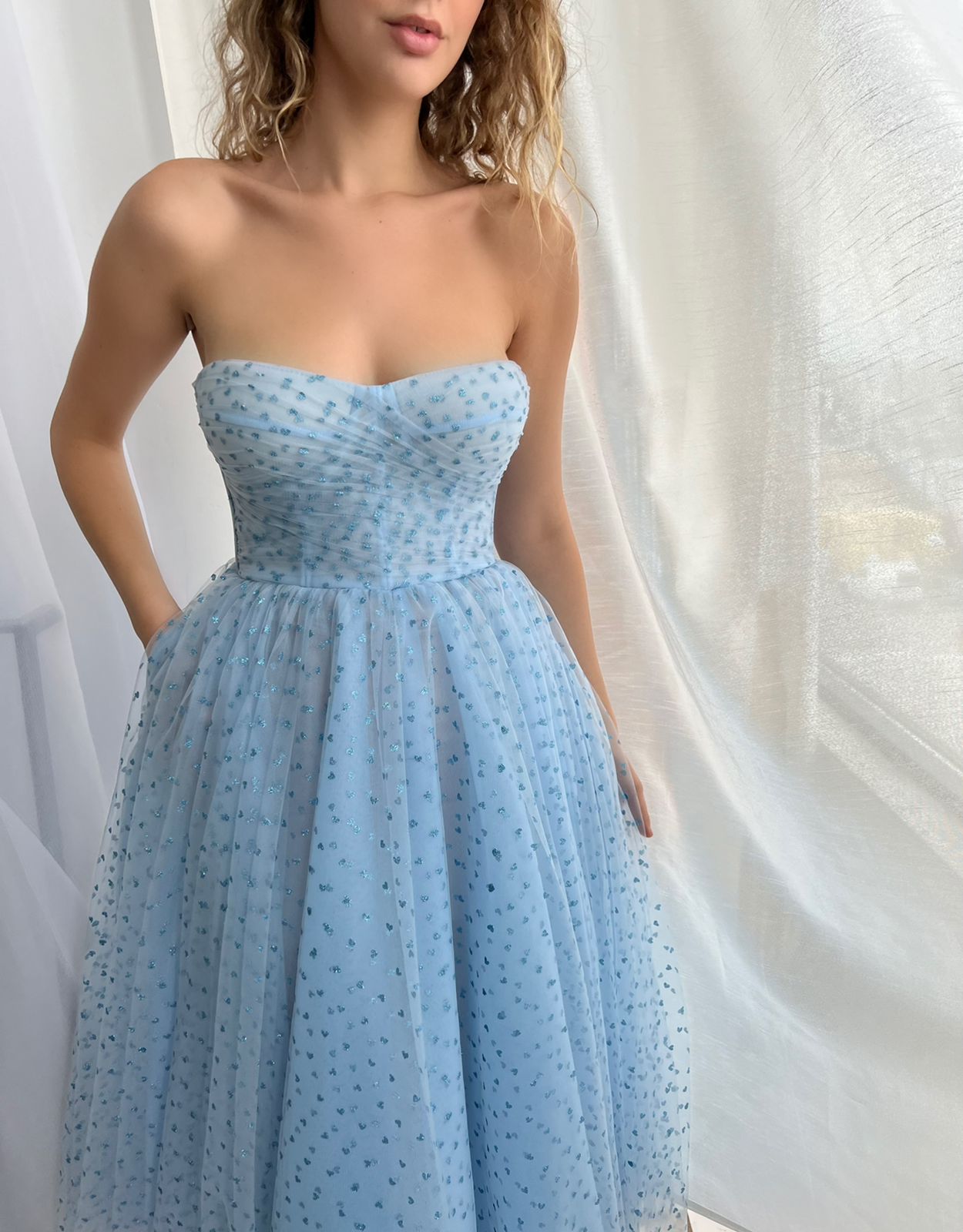 Blue midi dress with no sleeves and hearty fabric