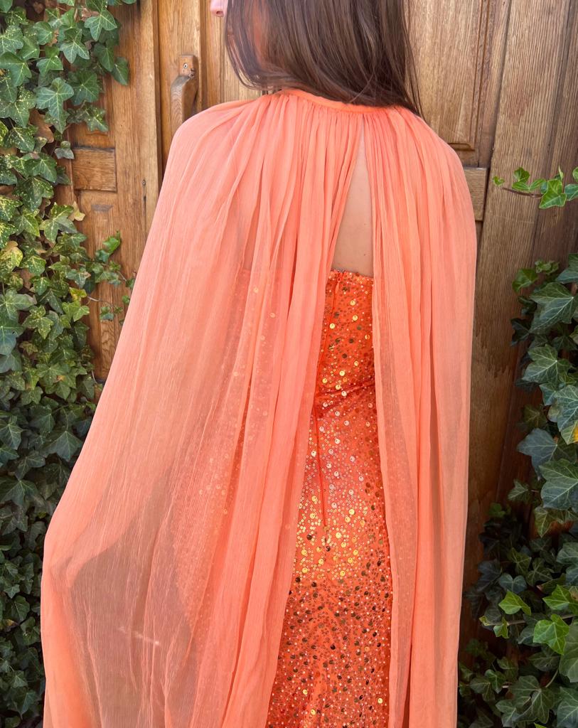 Orange mermaid dress with cape, no sleeves and sequins