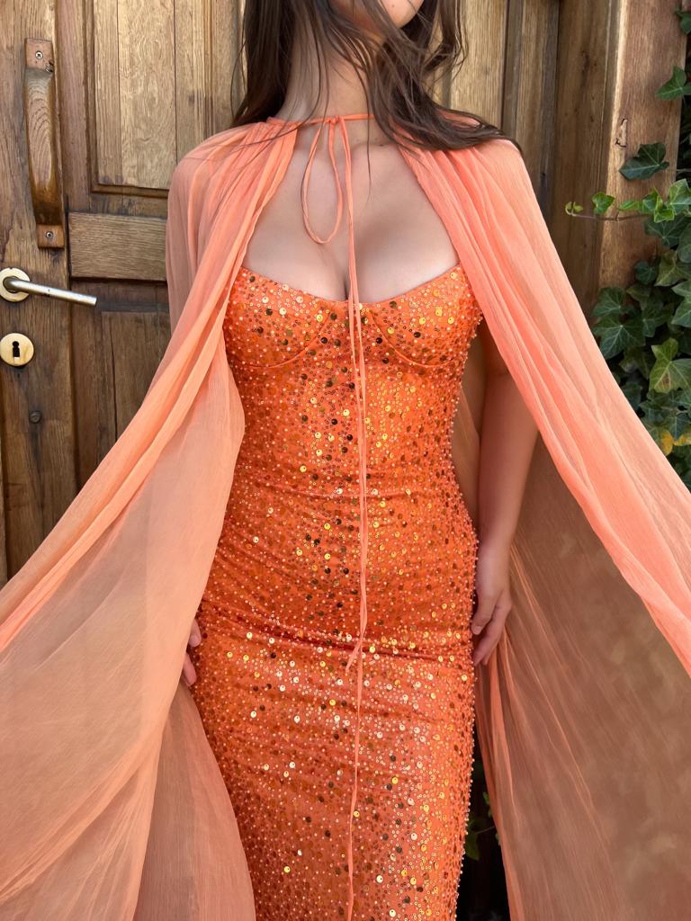Orange mermaid dress with cape, no sleeves and sequins