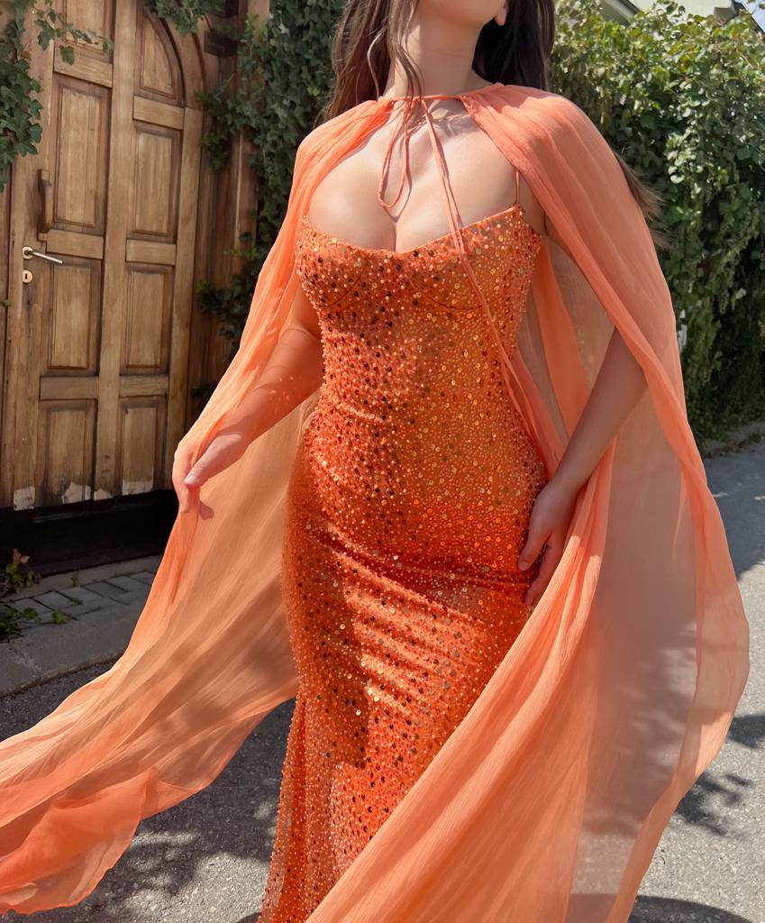 Orange mermaid dress with cape, no sleeves and sequins