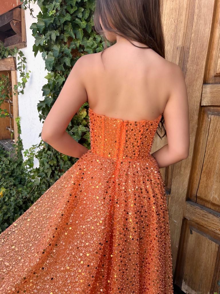 Orange midi dress with cape and no sleeves