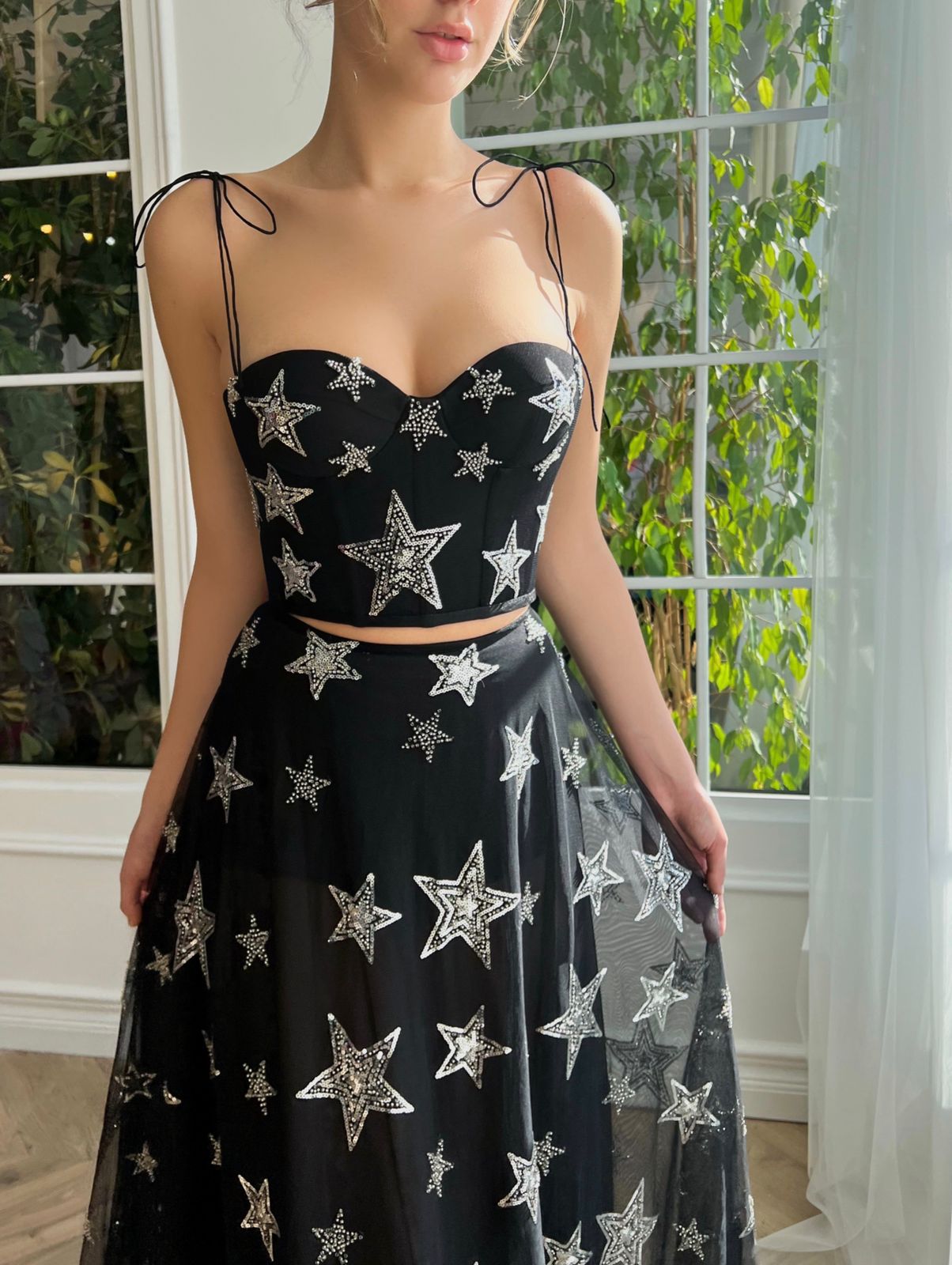Black two piece dress with spaghetti straps and starry fabric