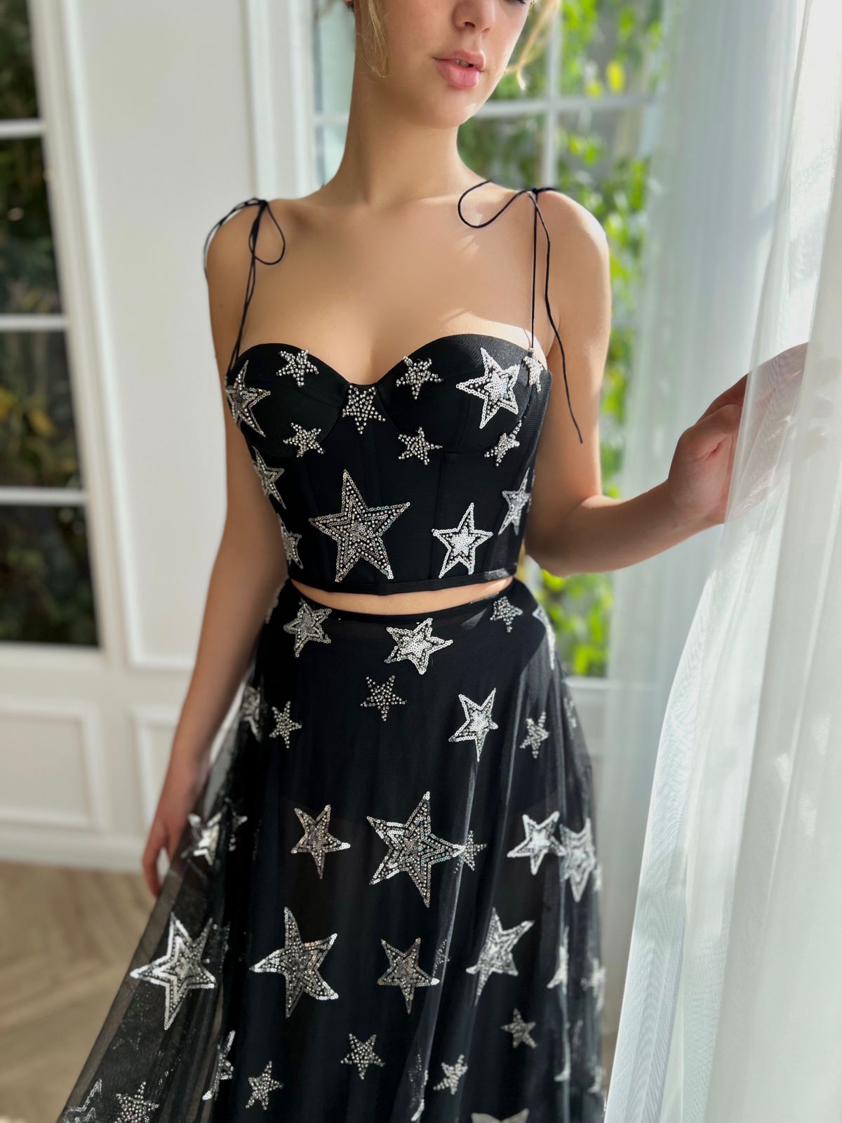 Black two piece dress with spaghetti straps and starry fabric