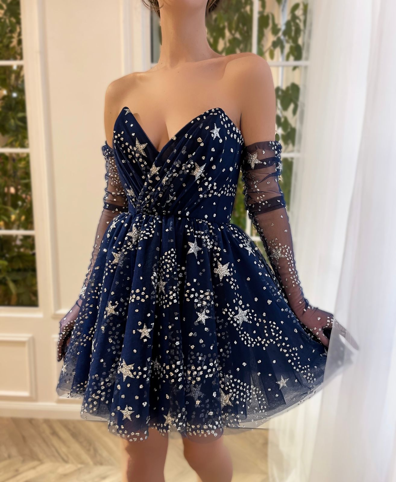 Blue mini dress with no sleeves, gloves and starry fabric