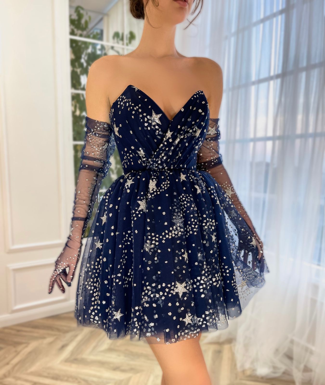 Blue mini dress with no sleeves, gloves and starry fabric