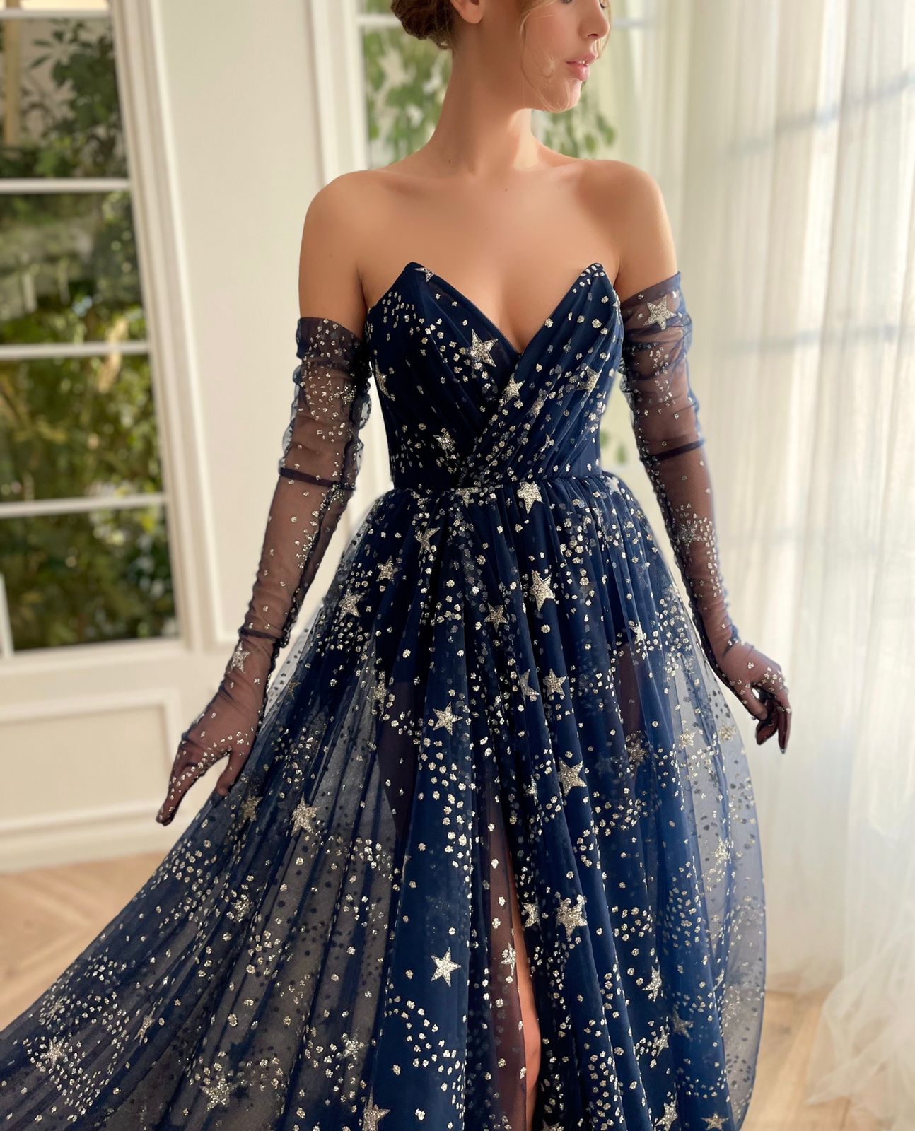 Blue A-Line dress with no sleeves, gloves and starry fabric