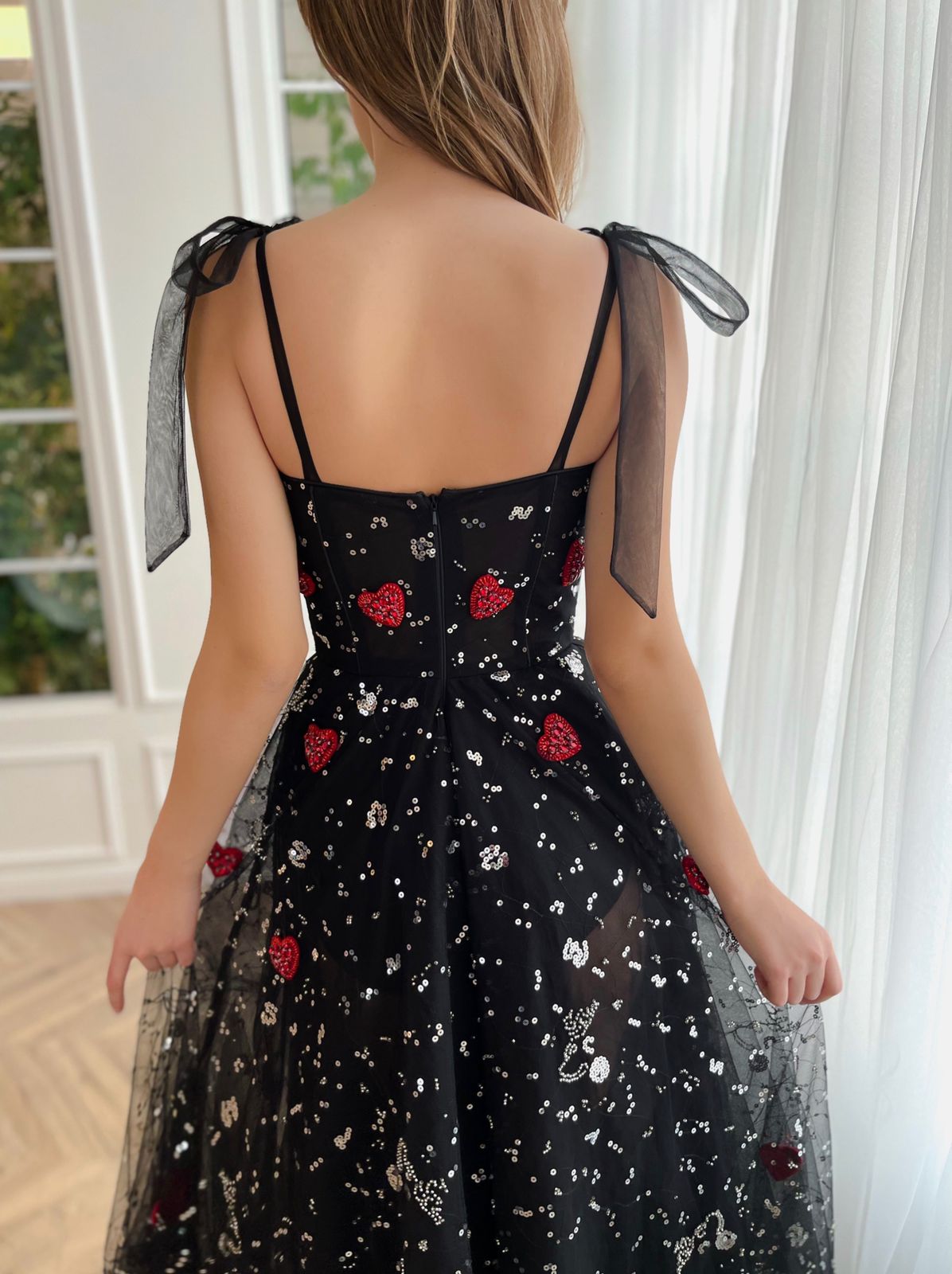 Black A-Line dress with bow straps and printed fabric