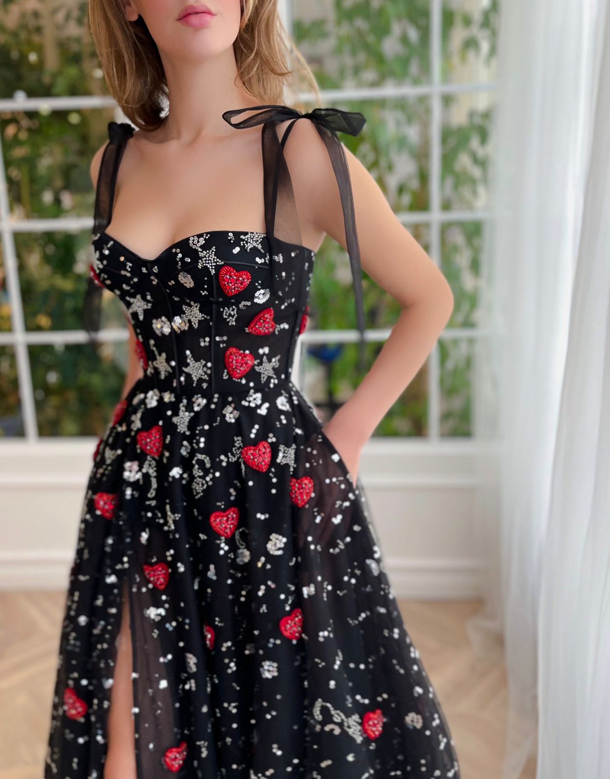 Black A-Line dress with bow straps and printed fabric