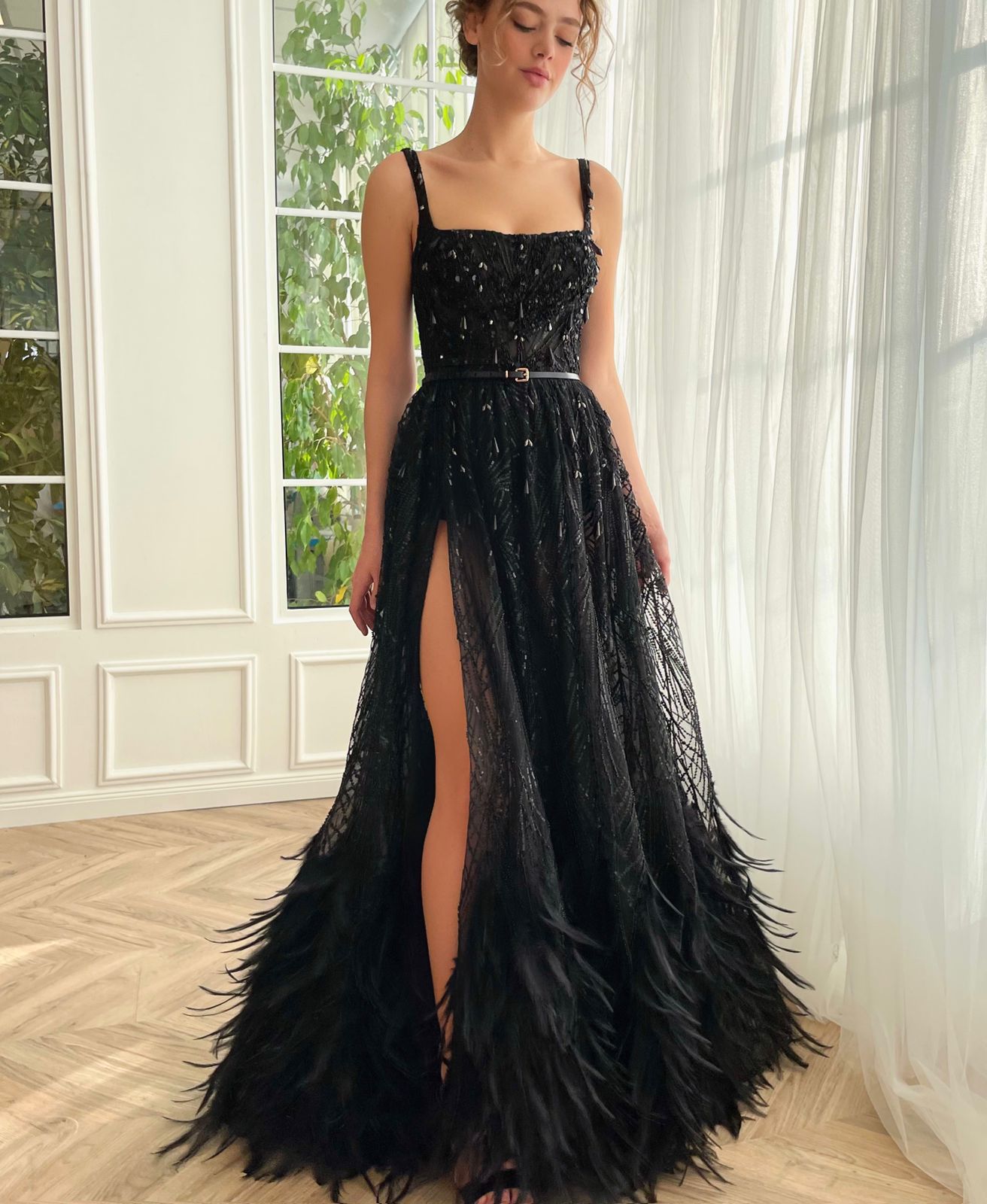 Black A-Line dress with spaghetti straps and feathers