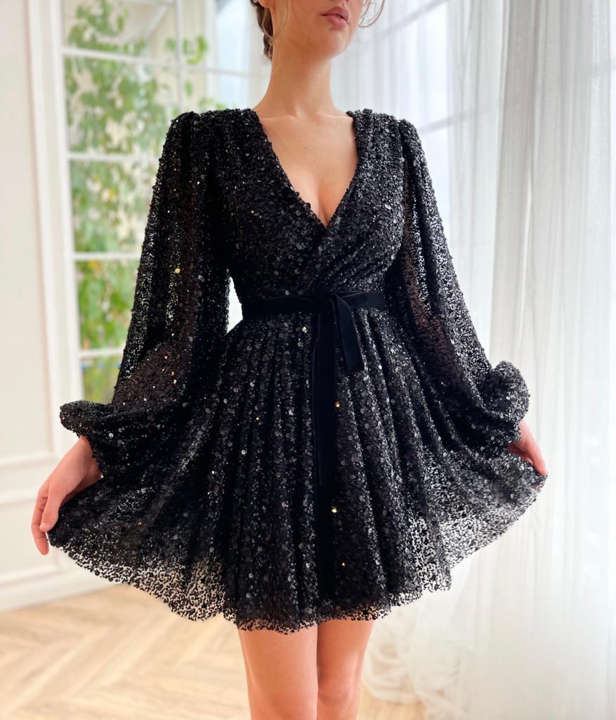 Black mini dress with long sleeves and v-neck
